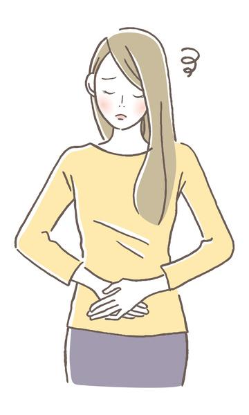 切迫流産の症状、下腹部痛でお腹をおさえる妊婦